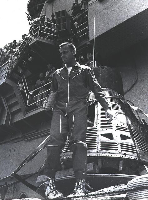 Alan Shepard standing beside the recovered Freedom 7 spacecraft