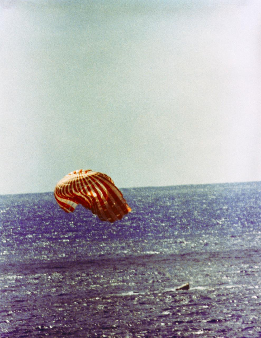Gemini 11 capsule splashing down near the USS Guam