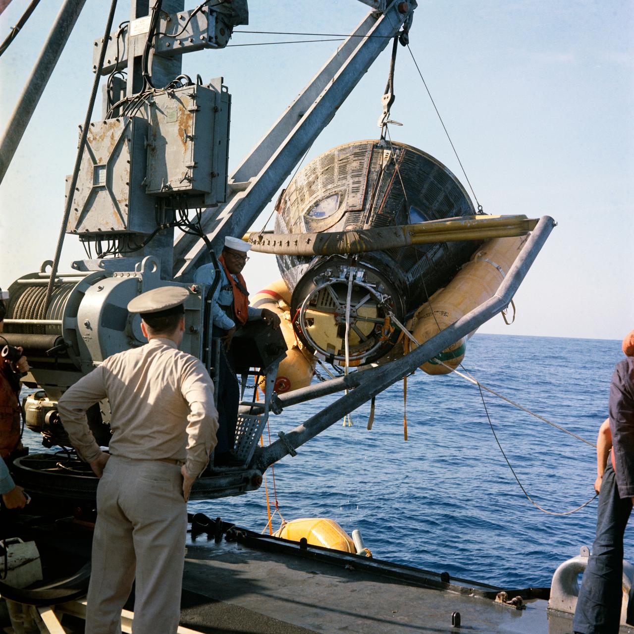 Gemini 8 capsule being hoisted aboard the USS Leonard F. Mason after recovery